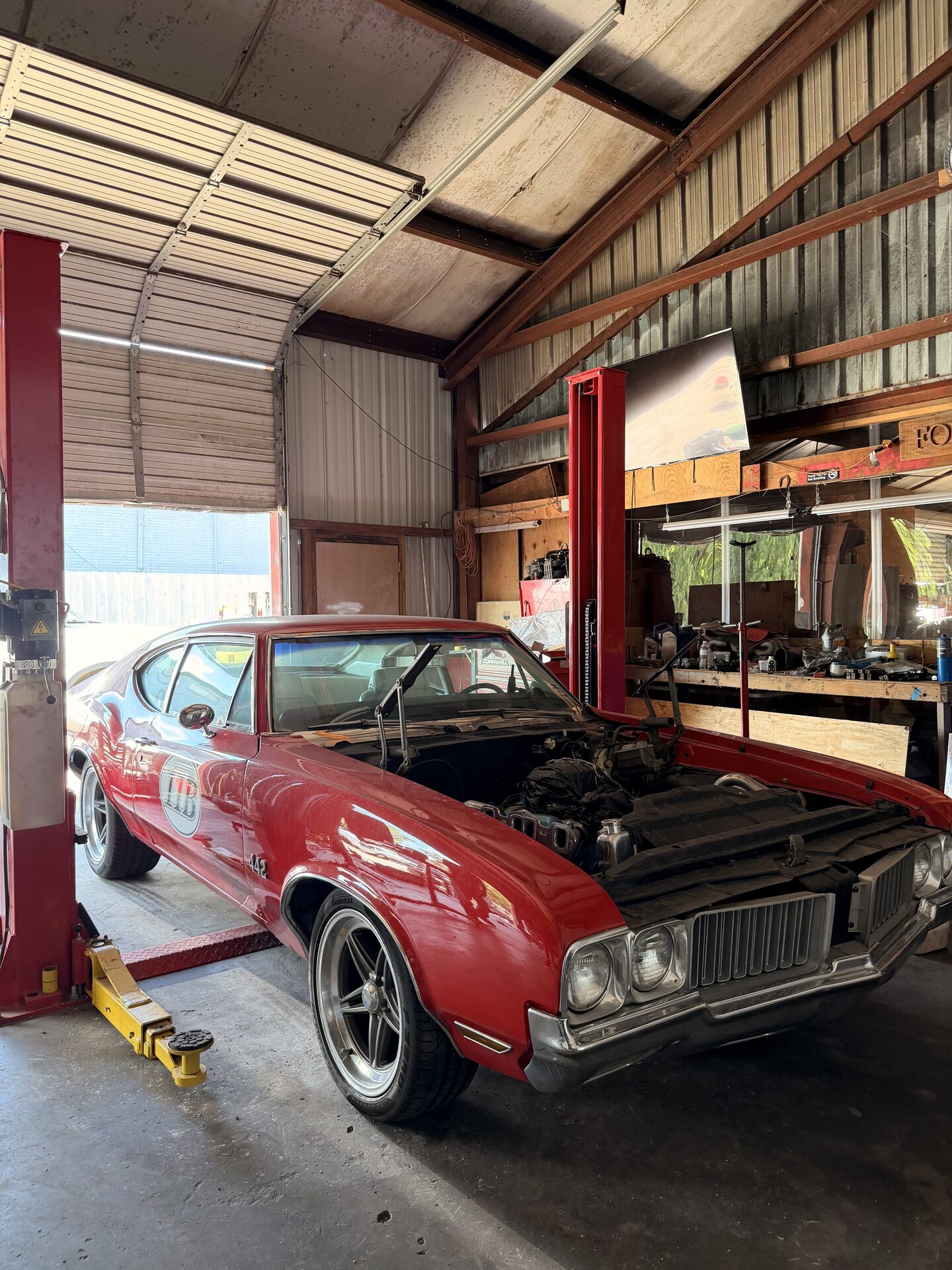 Oldsmobile Cutlass on a lift